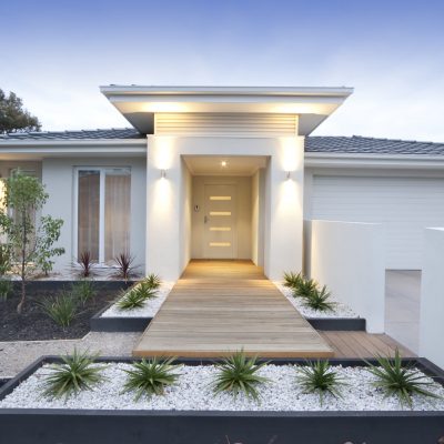 Front view of contemporary home in Australia Facade and entry to a contemporary white rendered home in Australia.